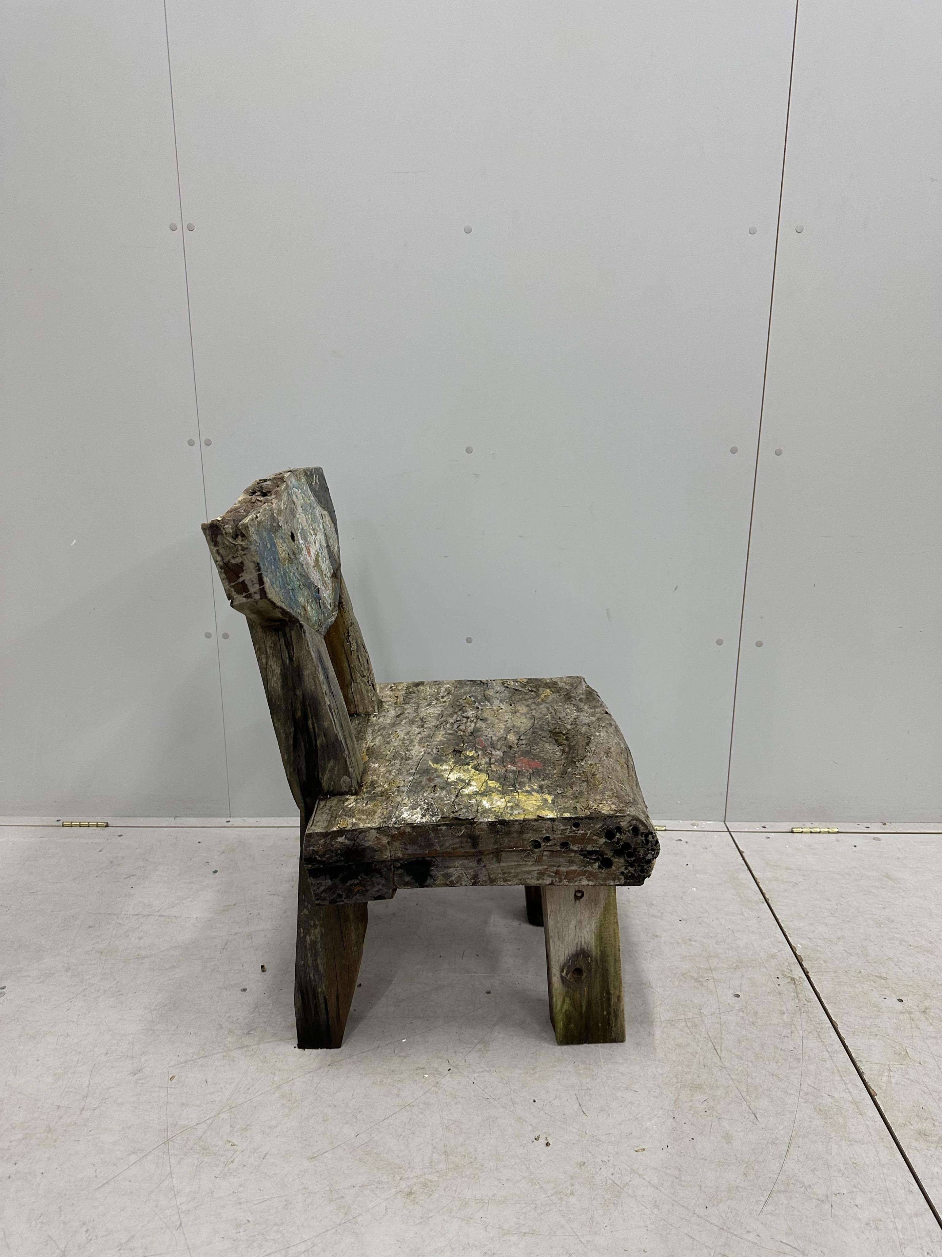 A painted primitive style chair, width 60cm, depth 53cm, height 89cm. Condition - fair